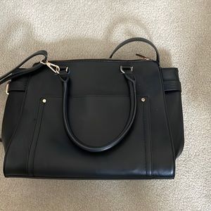 Black bag with plenty of pockets and crossbody strap.